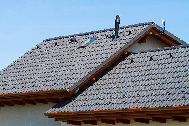 modern roof of a detached house against the blue sky
